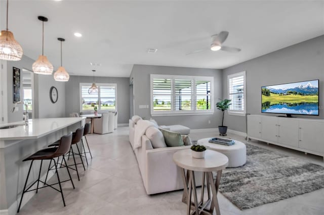 10414 Spring Tide Way, Parrish, FL 34219 - living room featuring ceiling fan, baseboards, and recessed lighting