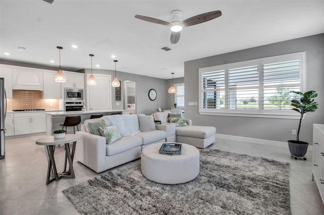 10414 Spring Tide Way, Parrish, FL 34219 - living area featuring ceiling fan, baseboards, recessed lighting, and light tile patterned floors