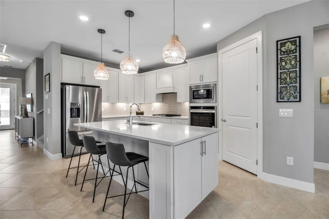 10414 Spring Tide Way, Parrish, FL 34219 - kitchen with appliances with stainless steel finishes, a sink, backsplash, baseboards, and recessed lighting