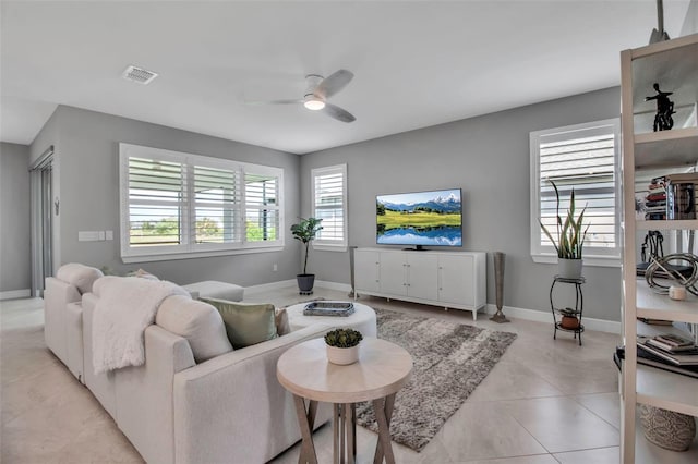 10414 Spring Tide Way, Parrish, FL 34219 - living area featuring ceiling fan, baseboards, and light tile patterned flooring