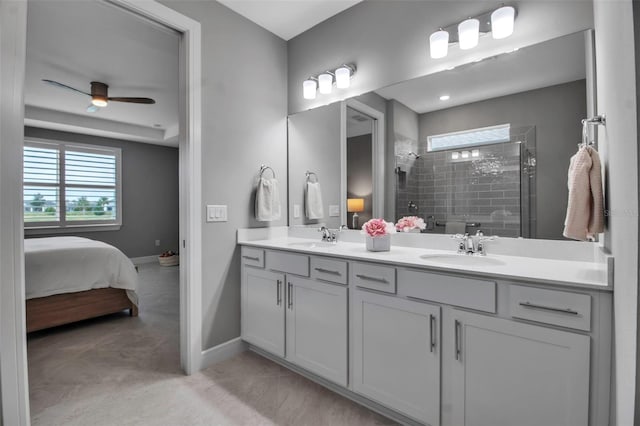 10414 Spring Tide Way, Parrish, FL 34219 - bathroom with plenty of natural light, tiled shower, baseboards, and double vanity