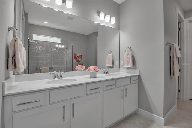 10414 Spring Tide Way, Parrish, FL 34219 - full bathroom with tiled shower, double vanity, and baseboards