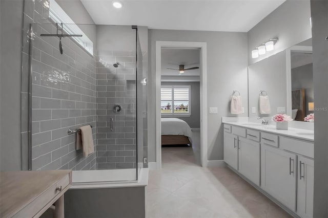 10414 Spring Tide Way, Parrish, FL 34219 - full bathroom featuring ensuite bath, a stall shower, ceiling fan, double vanity, and baseboards