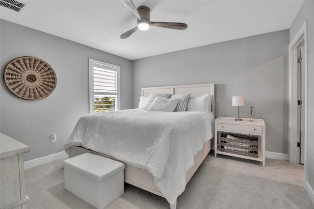 10414 Spring Tide Way, Parrish, FL 34219 - bedroom with carpet floors, baseboards, and a ceiling fan