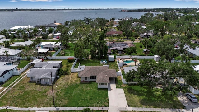 aerial perspective of suburban area with a nearby body of water