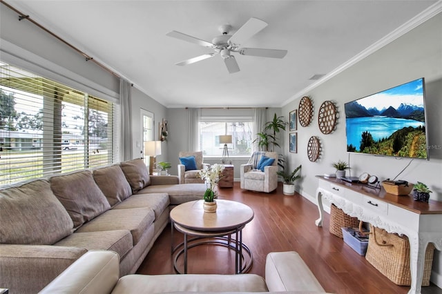 living room with crown molding, wood finished floors, a ceiling fan, and baseboards