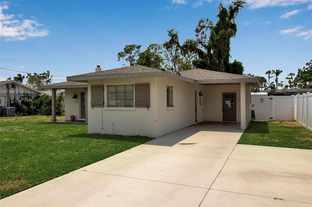 view of front of house featuring concrete driveway, stucco siding, and central AC