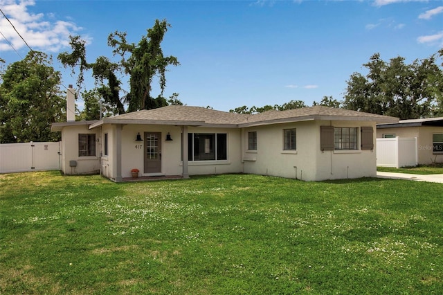 single story home featuring stucco siding and a gate