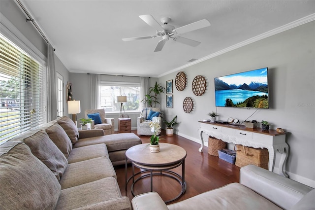 living room featuring ornamental molding, wood finished floors, baseboards, and ceiling fan