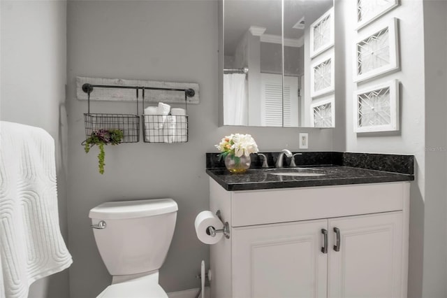 full bathroom featuring toilet and vanity
