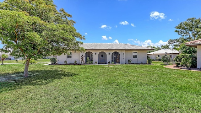 445 Matisse Cir S Unit 445, Nokomis, FL 34275 - view of front facade with stucco siding and a front lawn
