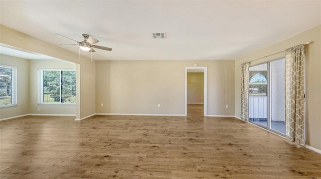 445 Matisse Cir S Unit 445, Nokomis, FL 34275 - unfurnished room with wood finished floors, ceiling fan, and baseboards