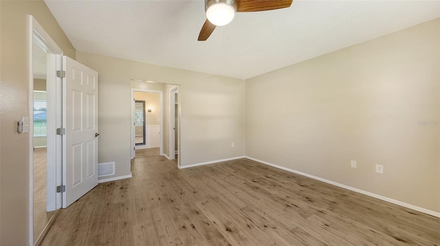 445 Matisse Cir S Unit 445, Nokomis, FL 34275 - unfurnished room with a ceiling fan, light wood-style floors, and baseboards