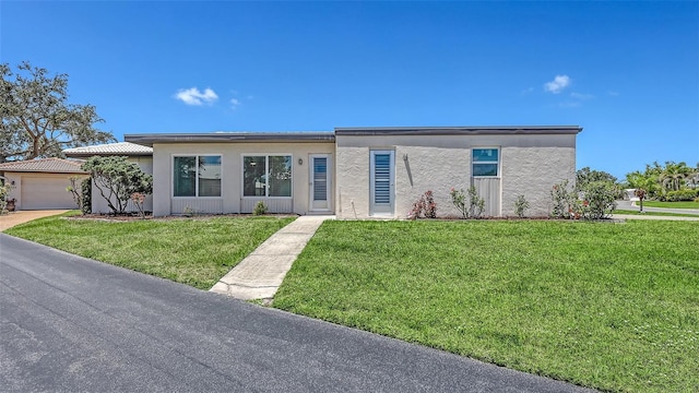 445 Matisse Cir S Unit 445, Nokomis, FL 34275 - view of front of property featuring a front lawn and stucco siding