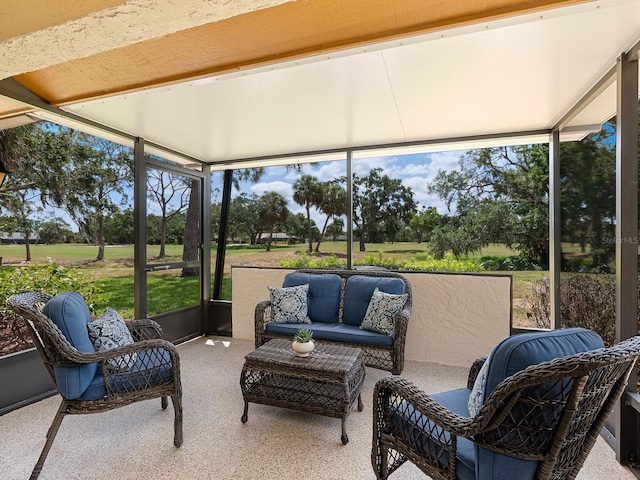 sunroom / solarium featuring an outdoor hangout area and healthy amount of natural light