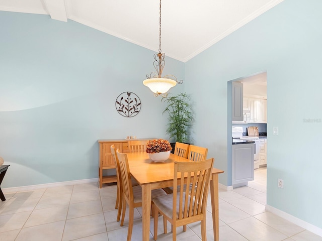 dining area featuring crown molding, light tile patterned floors, high vaulted ceiling, and baseboards