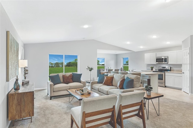 1446 Appaloosa St, Port Charlotte, FL 33980 - living room with vaulted ceiling, light colored carpet, and recessed lighting