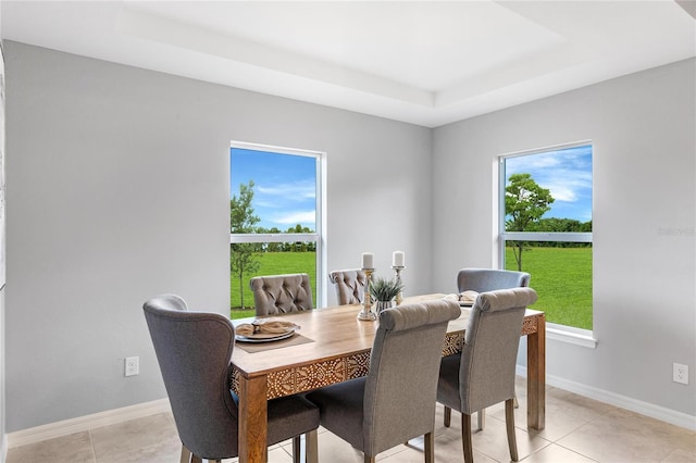 1446 Appaloosa St, Port Charlotte, FL 33980 - dining room with a raised ceiling, baseboards, and light tile patterned flooring