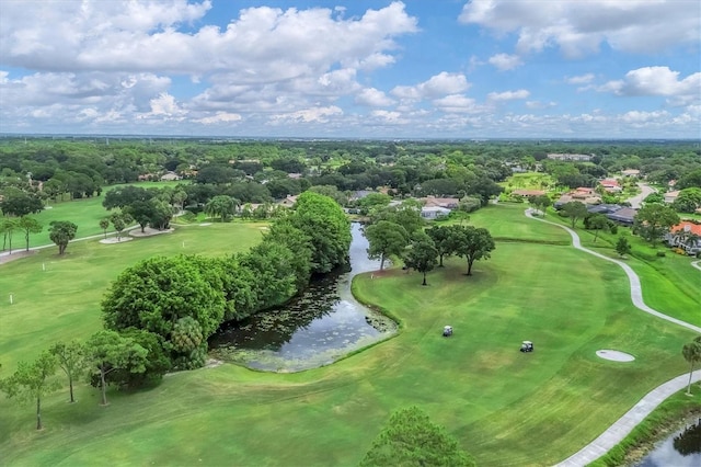bird's eye view of a nearby body of water, a tree filled landscape, and a golf club