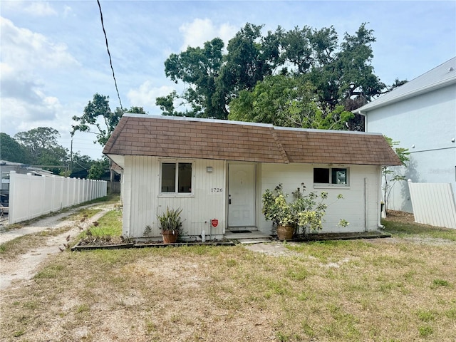 1726 8th St, Sarasota, FL 34236 - bungalow-style home featuring mansard roof, roof with shingles, and dirt driveway