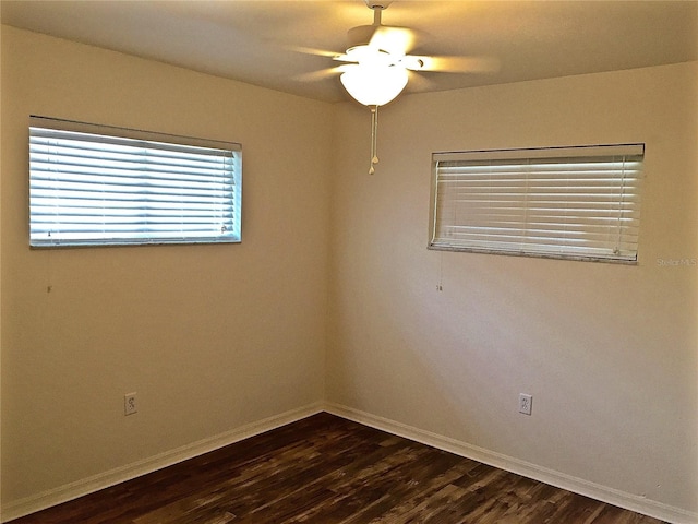 1726 8th St, Sarasota, FL 34236 - unfurnished room featuring dark wood-type flooring, baseboards, and a ceiling fan