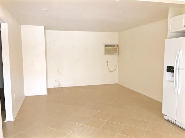 1726 8th St, Sarasota, FL 34236 - spare room featuring an AC wall unit and light tile patterned floors