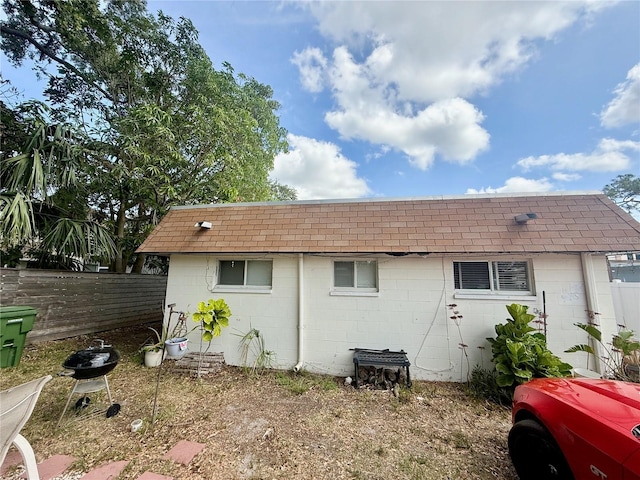 1726 8th St, Sarasota, FL 34236 - back of property with concrete block siding and fence