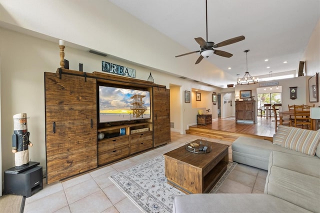 tiled living area with ceiling fan, recessed lighting, and vaulted ceiling