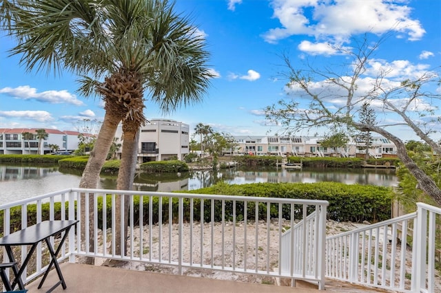 balcony featuring a water view and a residential view