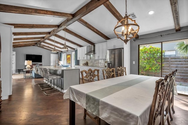 dining room with a chandelier, recessed lighting, and dark wood finished floors