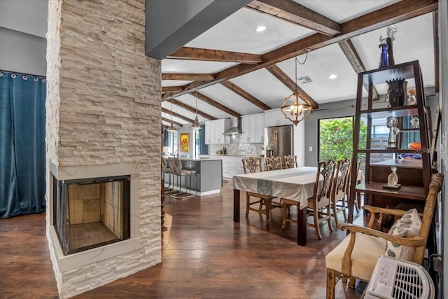 1809 Buccaneer Ter, Sarasota, FL 34231 - dining area featuring a chandelier, a fireplace, and dark wood finished floors