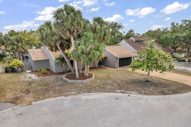 1809 Buccaneer Ter, Sarasota, FL 34231 - view of front facade featuring an attached garage and concrete driveway