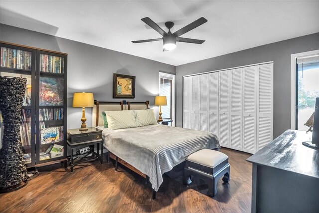 bedroom featuring wood finished floors, a closet, and a ceiling fan