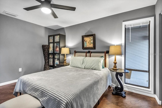 bedroom with baseboards, wood finished floors, and ceiling fan