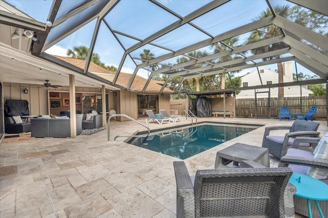 view of swimming pool featuring an outdoor hangout area, a jacuzzi, a patio, a ceiling fan, and glass enclosure