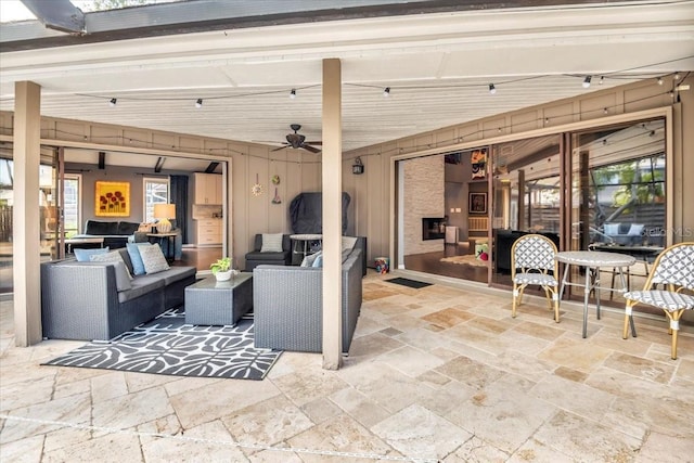 view of patio featuring a ceiling fan and outdoor lounge area