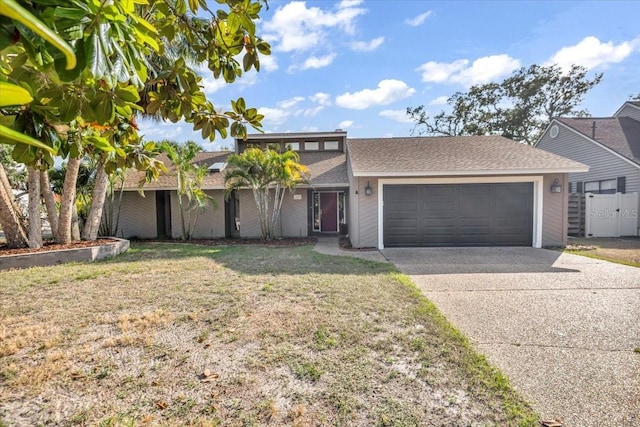 1809 Buccaneer Ter, Sarasota, FL 34231 - view of front facade featuring a garage, driveway, and roof with shingles