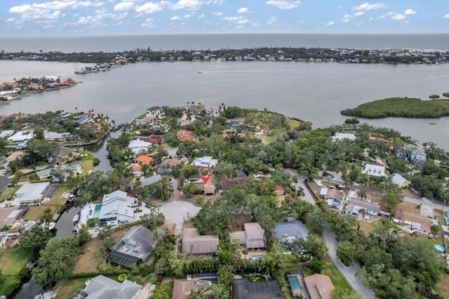 view of property location with a nearby body of water and nearby suburban area