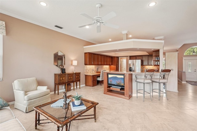 431 Fieldstone Dr, Venice, FL 34292 - living room featuring recessed lighting, a ceiling fan, ornamental molding, light tile patterned flooring, and baseboards