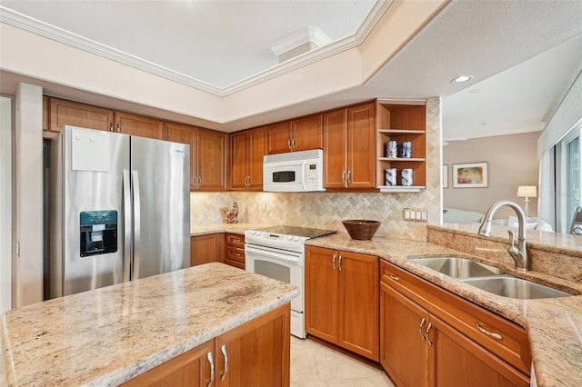 431 Fieldstone Dr, Venice, FL 34292 - kitchen featuring white appliances, a sink, brown cabinetry, crown molding, and light stone counters