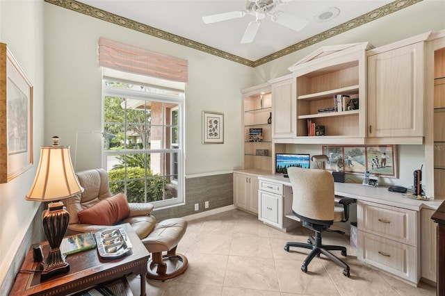 431 Fieldstone Dr, Venice, FL 34292 - home office with built in study area, ceiling fan, and light tile patterned floors