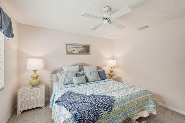 431 Fieldstone Dr, Venice, FL 34292 - carpeted bedroom with baseboards, ceiling fan, and a textured ceiling
