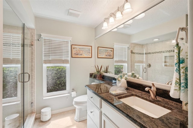 431 Fieldstone Dr, Venice, FL 34292 - bathroom featuring plenty of natural light, a stall shower, vanity, a textured ceiling, and toilet