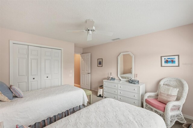 431 Fieldstone Dr, Venice, FL 34292 - carpeted bedroom featuring baseboards, a closet, and ceiling fan