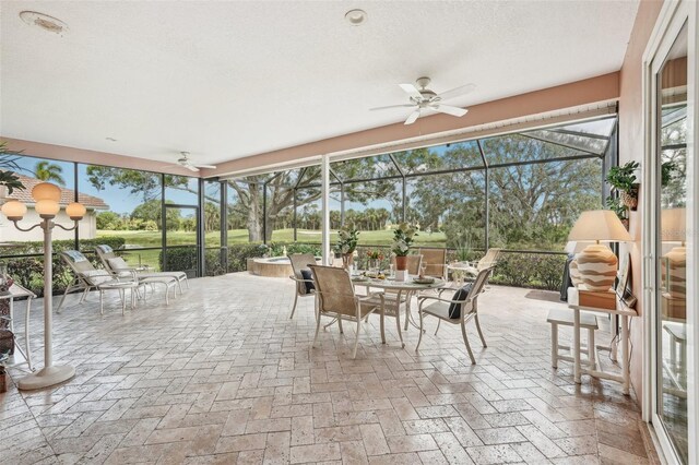 431 Fieldstone Dr, Venice, FL 34292 - sunroom / solarium with a ceiling fan and outdoor dining space