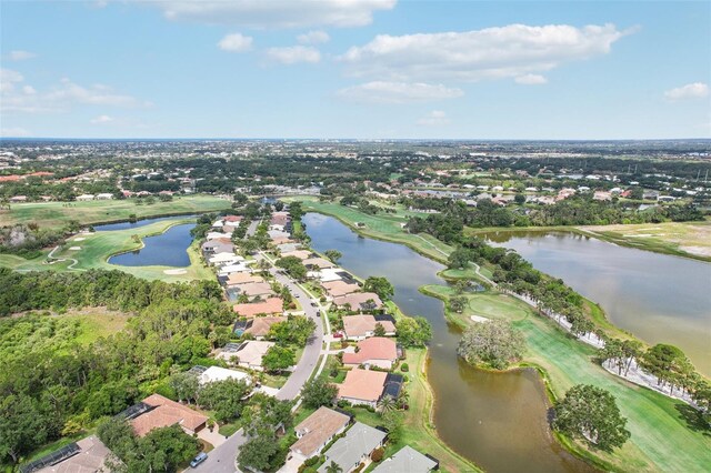 431 Fieldstone Dr, Venice, FL 34292 - aerial view of property and surrounding area featuring nearby suburban area, a large body of water, and a local golf course