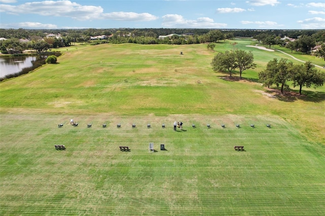 431 Fieldstone Dr, Venice, FL 34292 - drone / aerial view of a local golf course, a nearby body of water, and a tree filled landscape