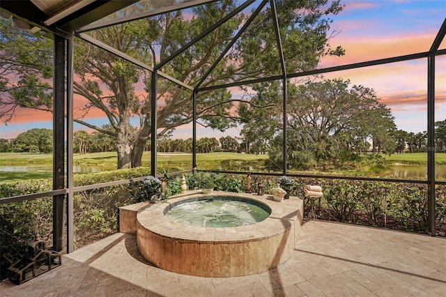 431 Fieldstone Dr, Venice, FL 34292 - sunroom / solarium featuring a hot tub, a water view, and view of wooded area