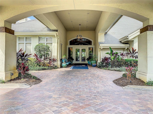 431 Fieldstone Dr, Venice, FL 34292 - view of exterior entry featuring french doors and stucco siding