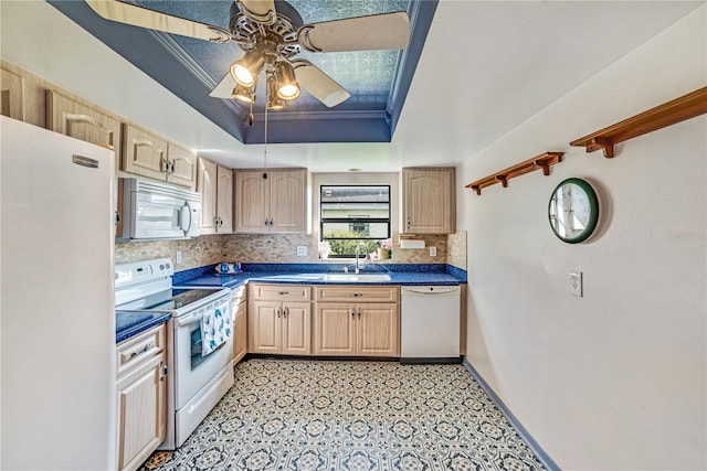 2607 Lancaster Dr Unit 35, Sun City Center, FL 33573 - kitchen featuring white appliances, light brown cabinetry, a tray ceiling, tasteful backsplash, and dark countertops